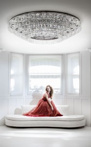 Check out the amazing chandelier, sofa... and model!